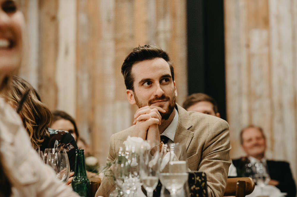 Relaxed Guest Reactions During Wedding Speeches