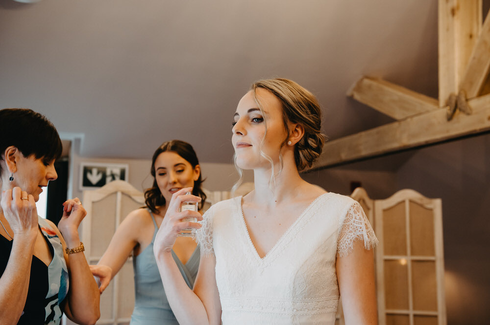 Bride Sprays Perfume, Surrey Wedding Photographer
