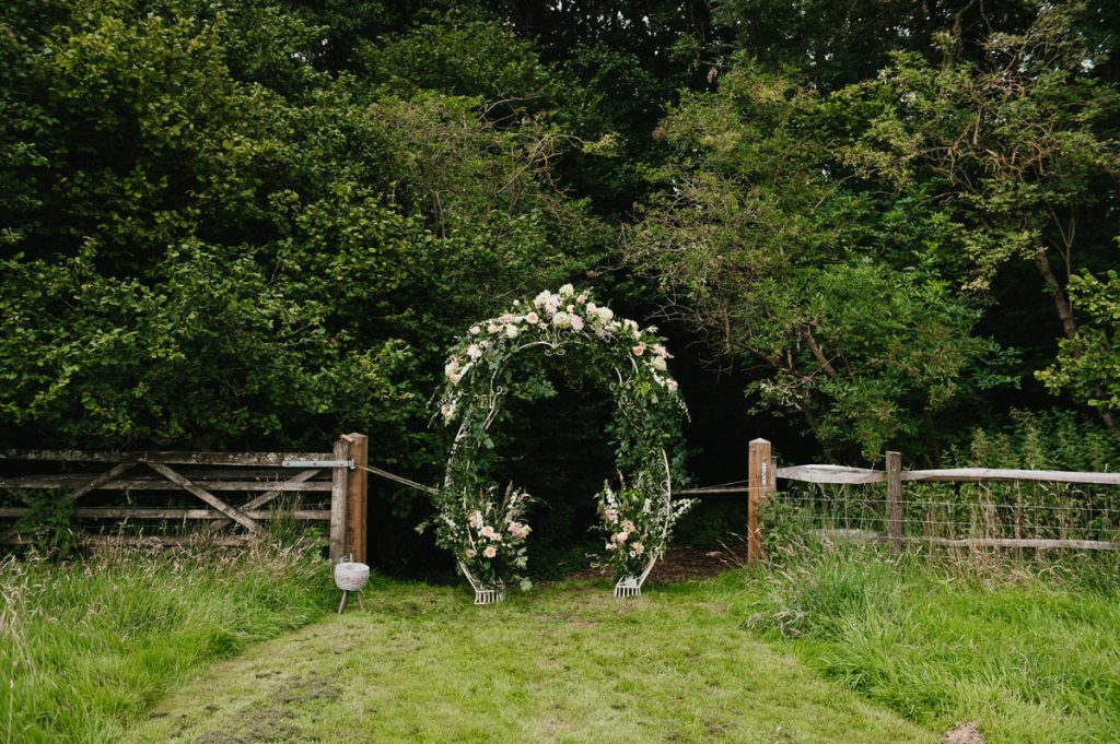 Outdoor floral archway, Surrey wedding photography