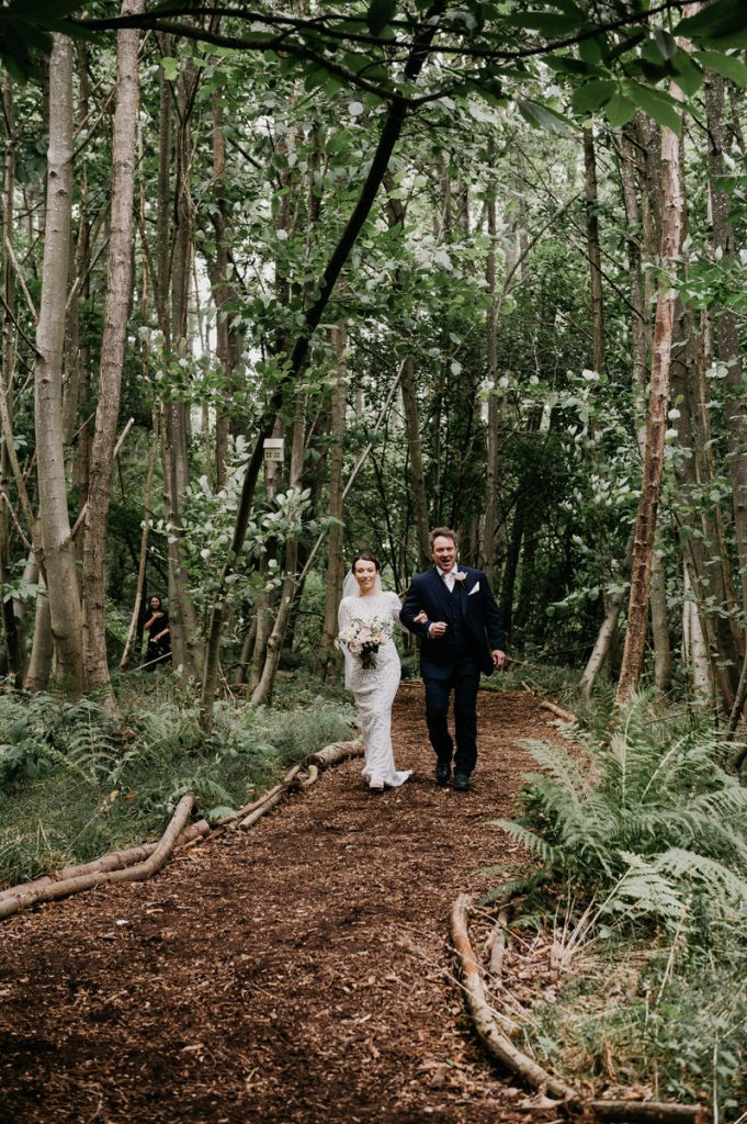 Bride and Father Enter Woodland Outdoor Wedding Together