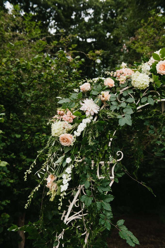 Outdoor floral archway, Surrey wedding photography