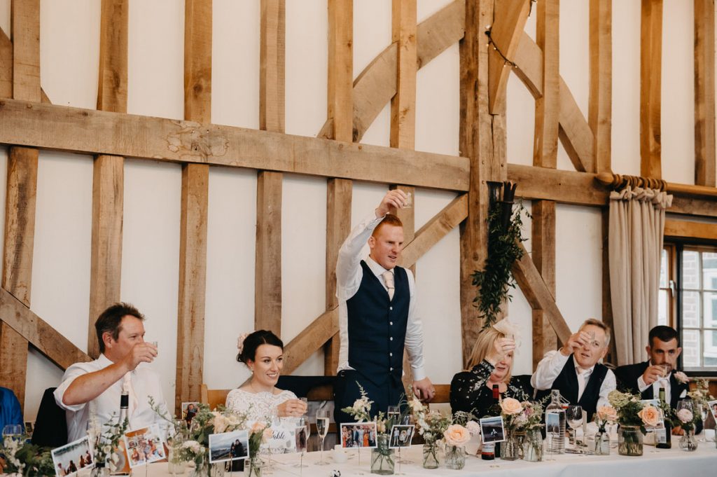 Groom Raises a Toast, Outdoor Gate Street Barn Wedding