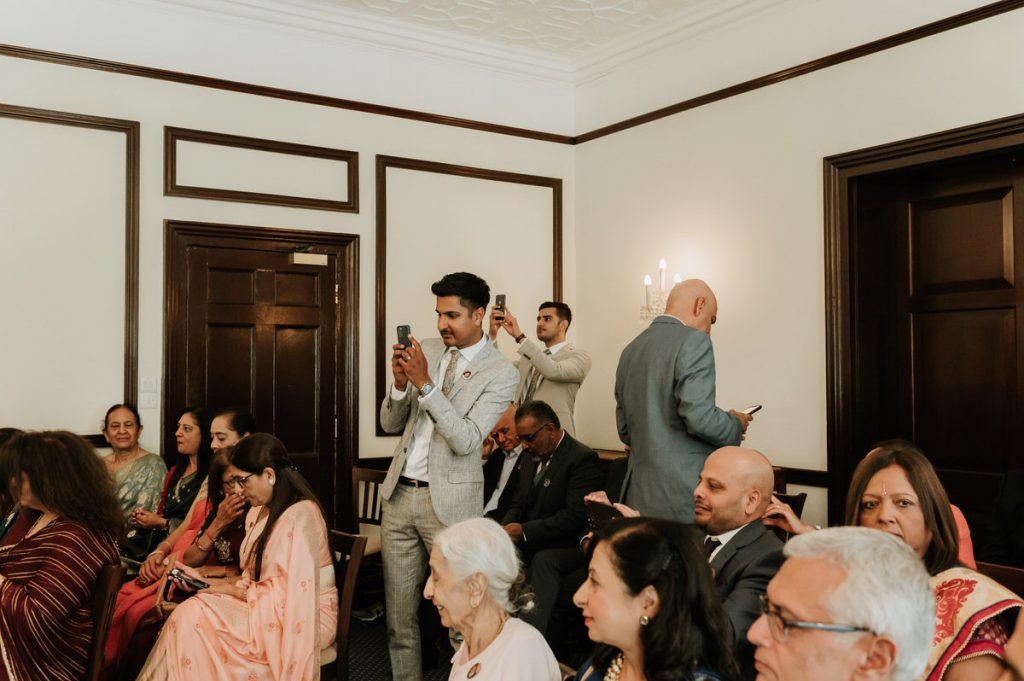 Candid Moment of Guests Taking Photographs