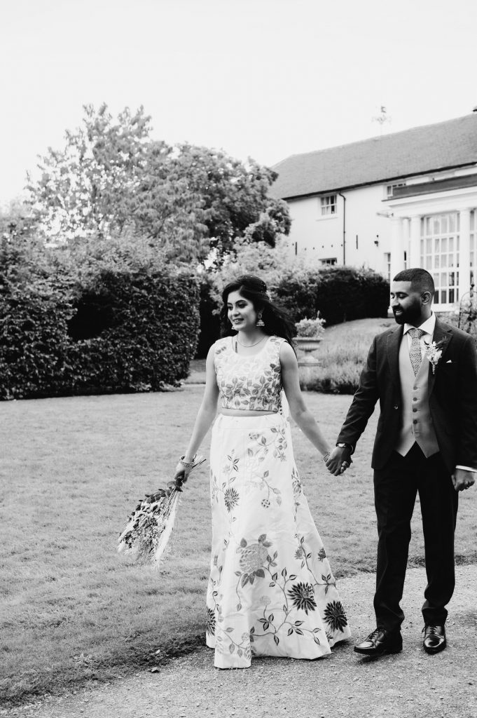 Black and White Natural Couples Walking in Leatherhead Registry Office Wedding