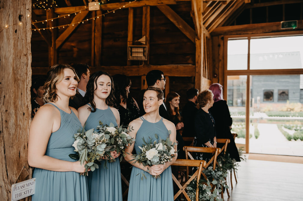 Bridesmaids Stand Together in Ceremony