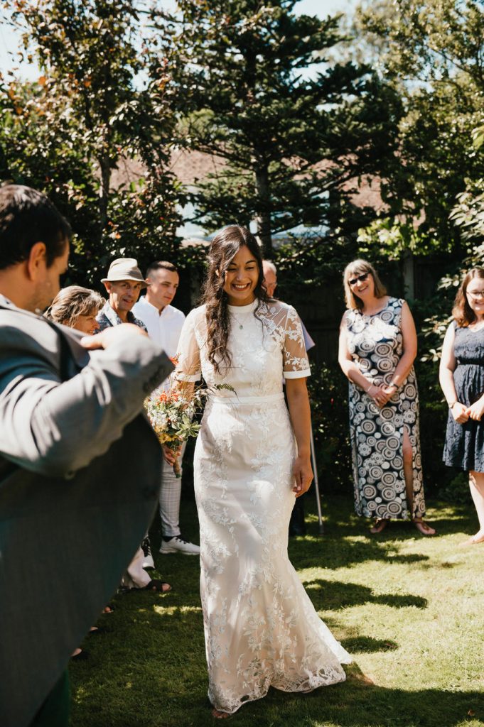 Bride Shows Family Her Dress, Surrey Wedding Photographer