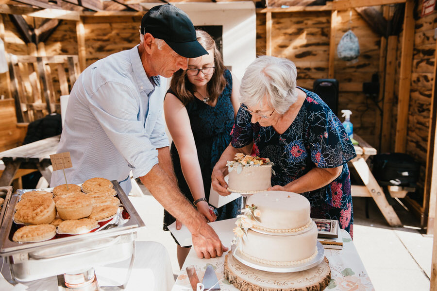 Family Members Help Construct Home Made Cake
