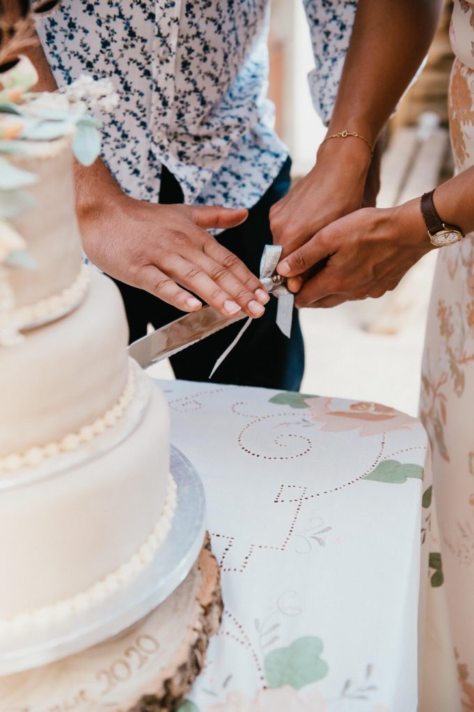 Couple Cut The Cake - Relaxed Surrey Marquee Wedding