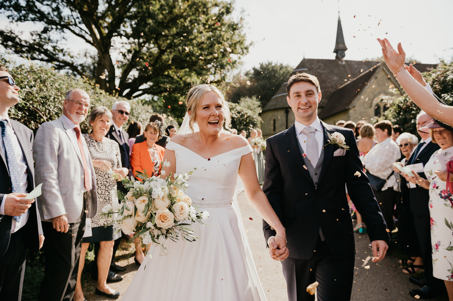 Documentary Wedding Photography Surrey, Couple Walk Down Confetti Aisle