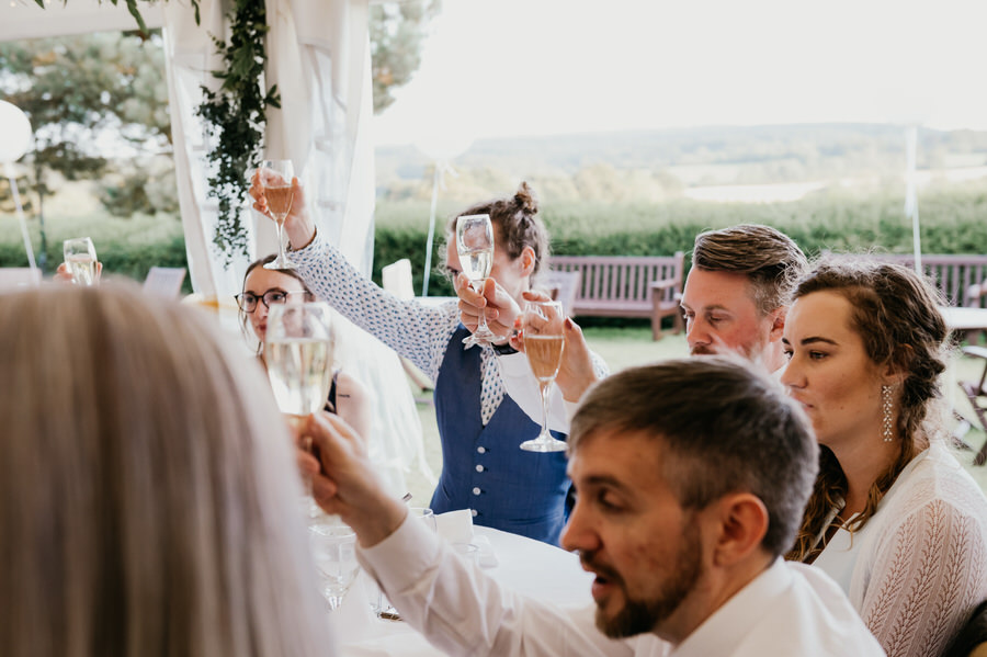 Guests Cheers During Speeches - Outdoor Surrey Marquee Wedding