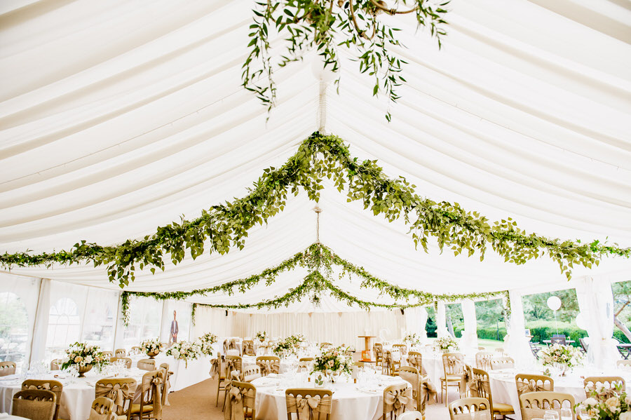 Beautiful Wedding Breakfast Room Decorated with Green Foliage