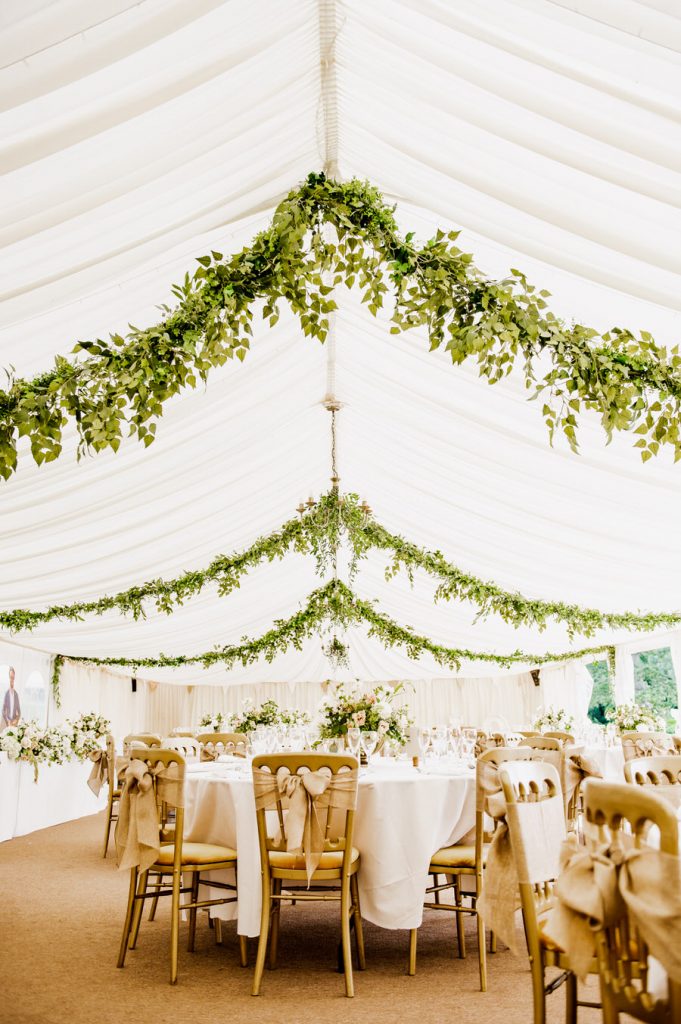 Beautiful Wedding Breakfast Room Decorated with Green Foliage
