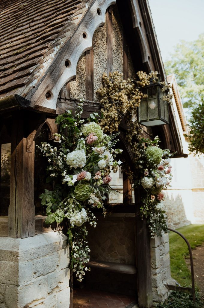 Church Door With Floral Archway