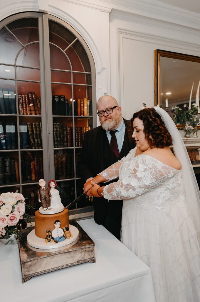 Couple Cut the Wedding Cake - Oatlands Park Hotel Wedding