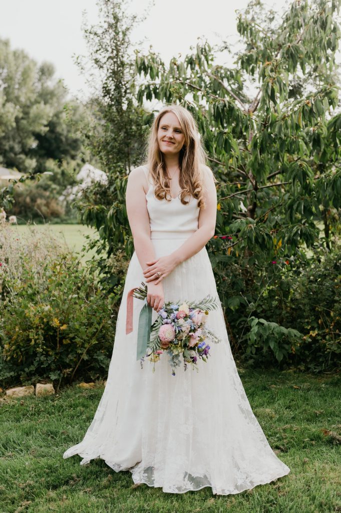 Bridal Portrait with Relaxed Pose and Wedding Florals