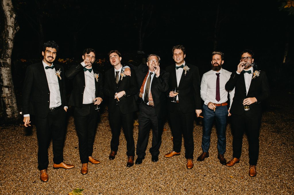 Documentary Evening Photography - Groomsmen Take a Moment With Cigars.