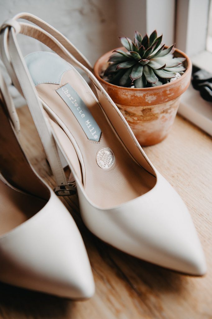 Wedding shoes with a lucky six pence in the sole. 