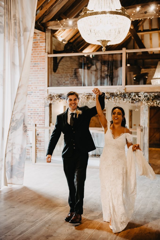 Couple Make an Entrance To Their Wedding Breakfast Room