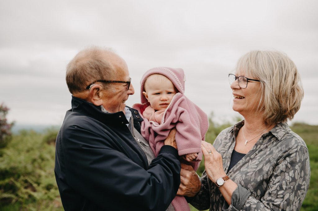 Grandparents with Their Grandchild in Outdoor Family Photography Shoot - Surrey