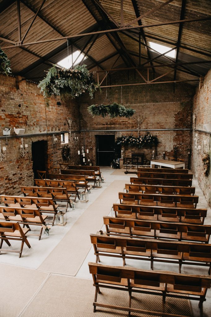 Rustic wedding barn at Botley Hill with floral decoration - Surrey Wedding Photography