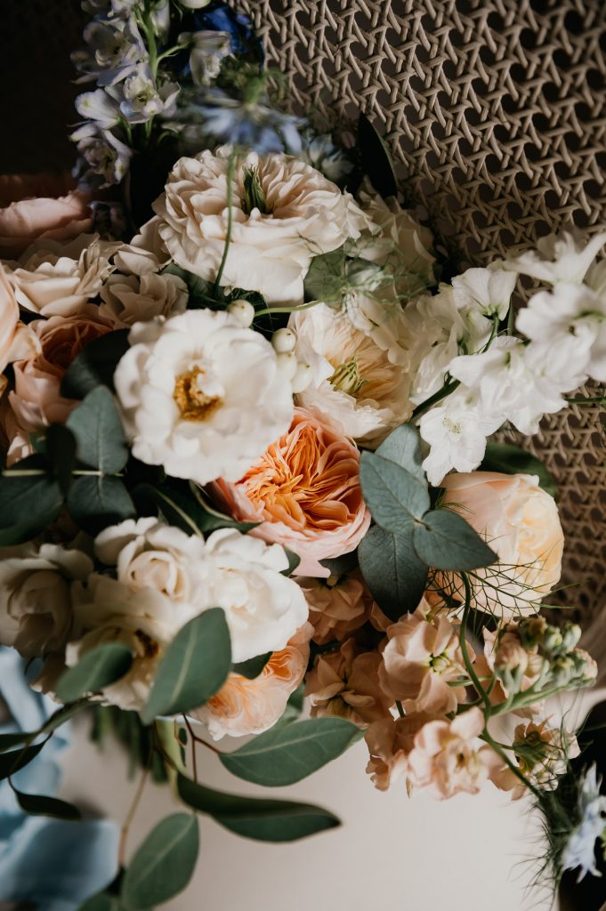 Delicate wedding bouquet with soft pink peonies and eucalyptus - Surrey wedding Photography