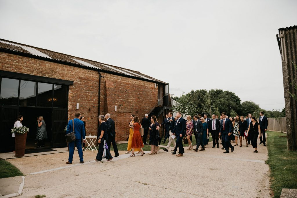Guests enter ceremony venue at the Barn at Botley Hill wedding