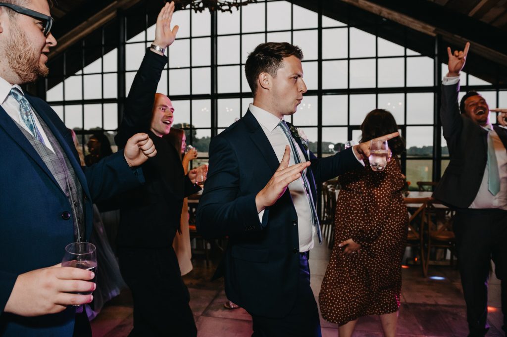Fun and candid dance floor action at Barn at Botely Hill wedding. 