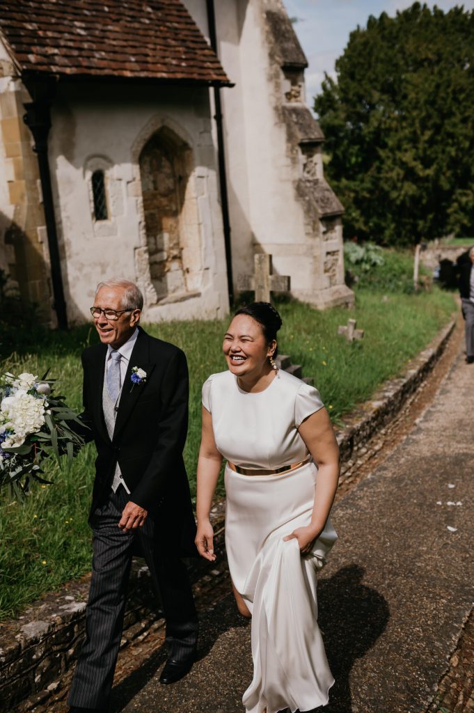 Smiling Marrier Arrives at Church for Wedding - Surrey Wedding Photographer