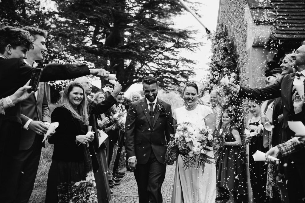 Candid Confetti Photography Outside Church - Surrey Village Hall Wedding