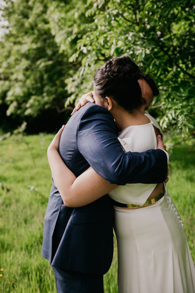 Couple Embrace and Hug During Couples Wedding Portraits