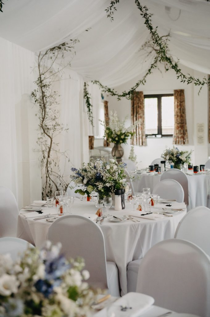 Soft White Table Flower Arrangements - Surrey Village Hall Wedding
