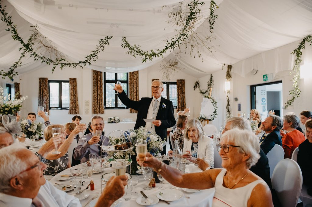 Wedding Guest Cheers During Speeches