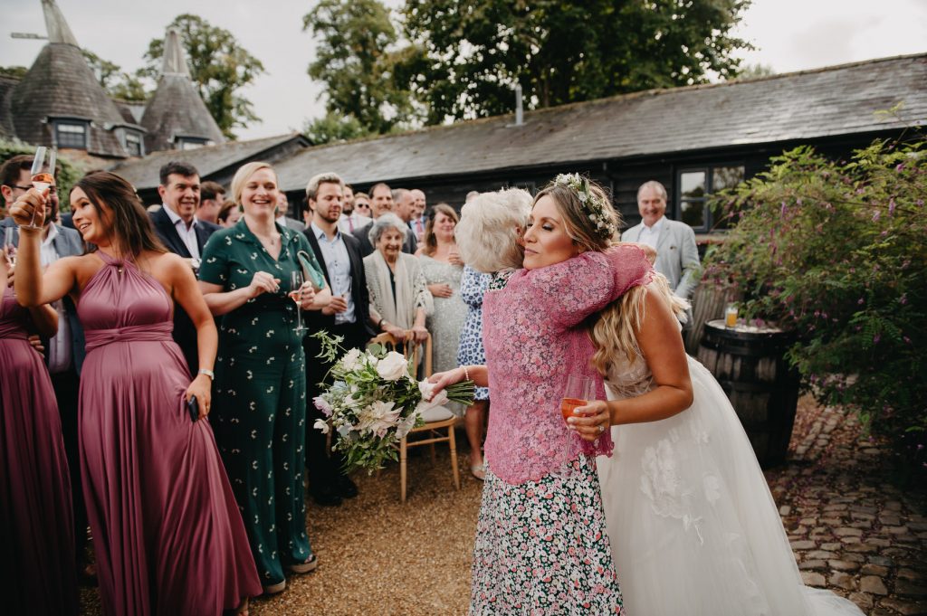 Bride Hugs Grandmother - Outdoor Wedding Speeches