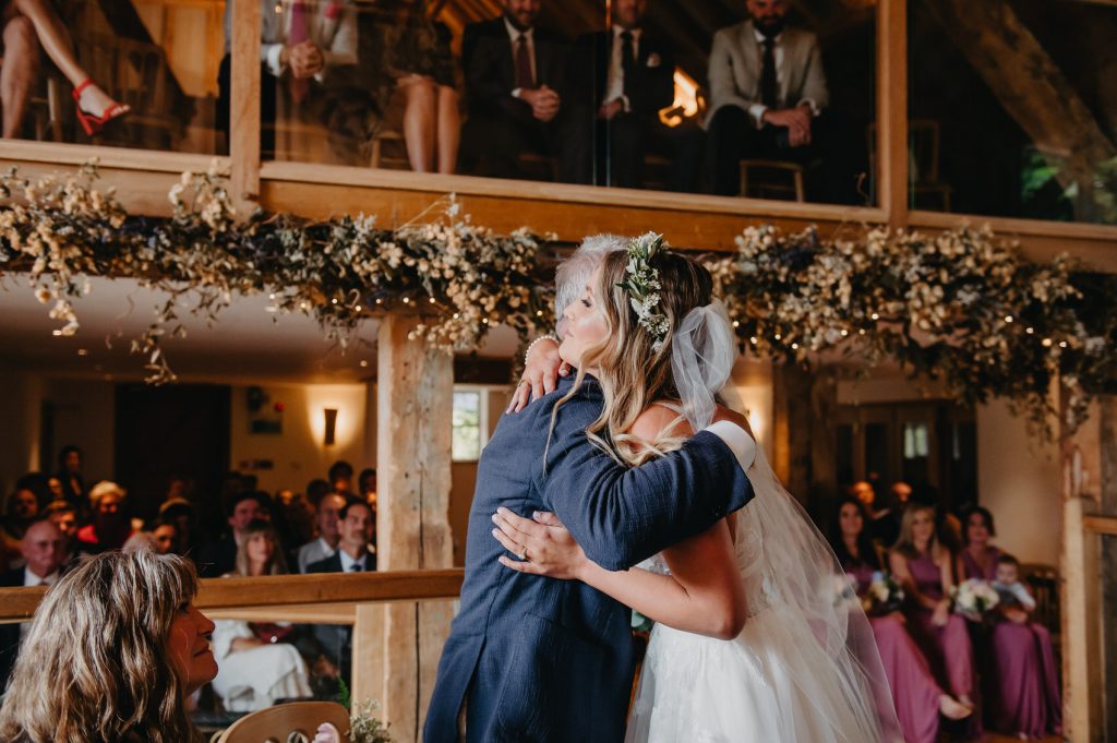 Father and Daughter Embrace at Wedding Ceremony