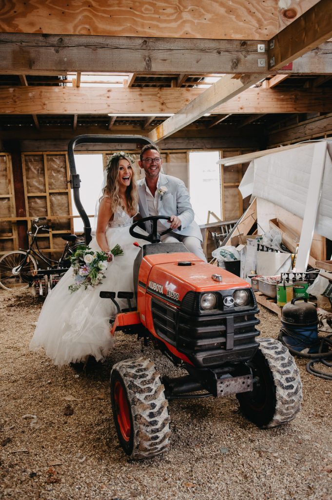Fun Wedding Portrait on Top of Tractor - Bury Court Barn Wedding