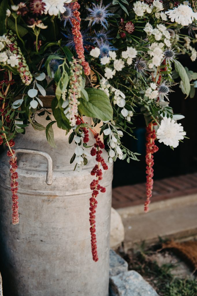 Wedding flower arrangement in milk jug, Surrey wedding photography
