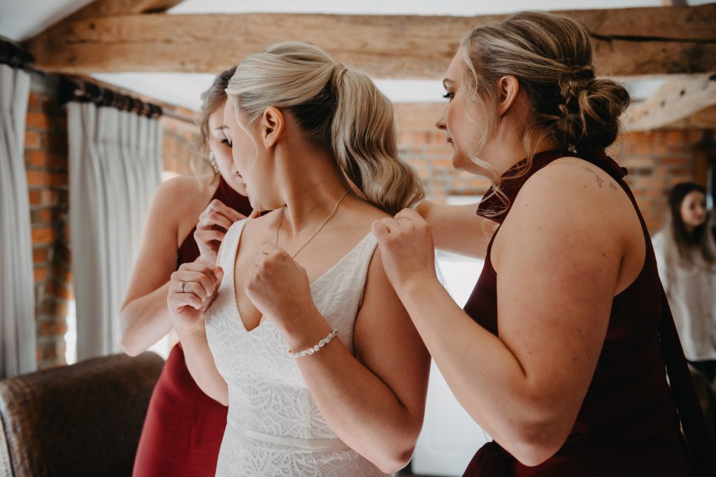 Bridesmaids Help With Final Touches - Wasing Park Wedding Photography