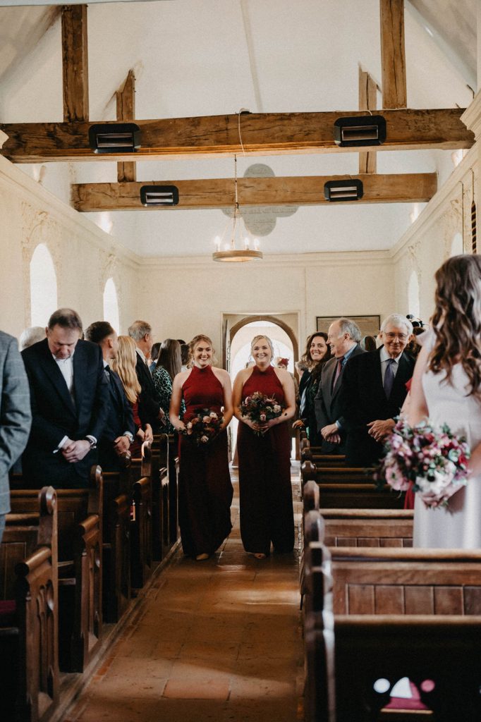 Bridesmaids Walk Down the Aisle in Intimate Church Wedding