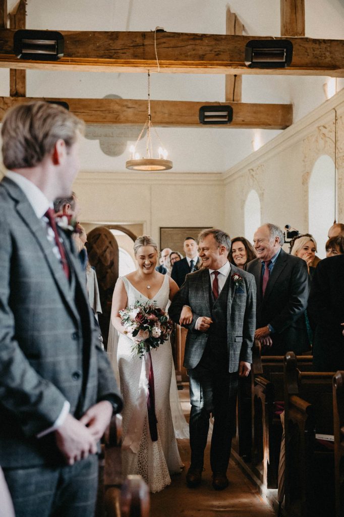Father and Daughter Enter Wedding Ceremony Together 