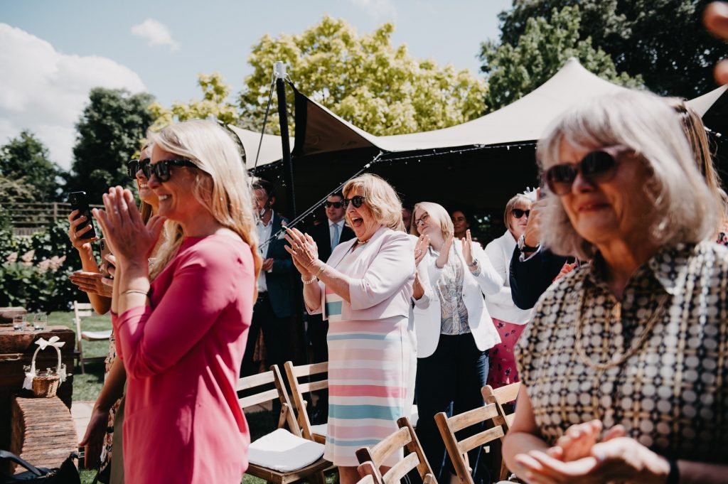 Guests Cheer and Celebrate - Relaxed Garden Marquee Wedding