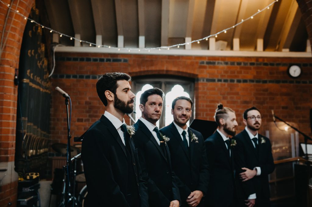 Groom Waits for Bride in Church - Old Luxters Barn Wedding