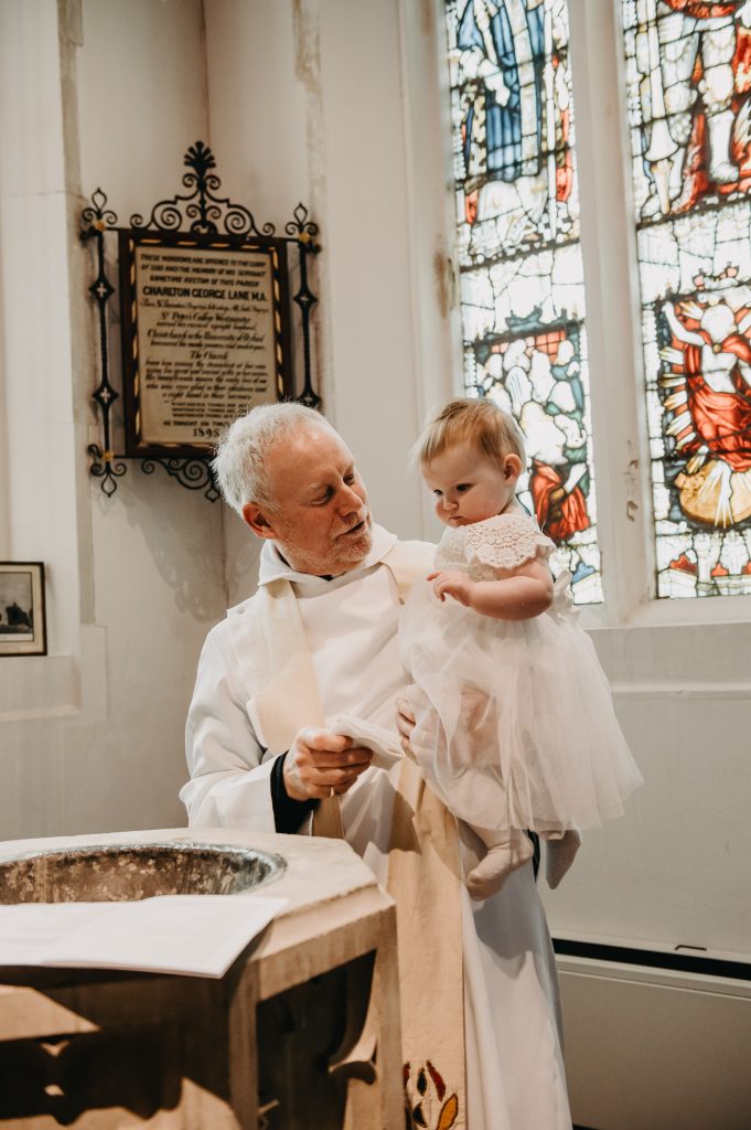 Vicar Performs Christening Holy Water Ceremony 