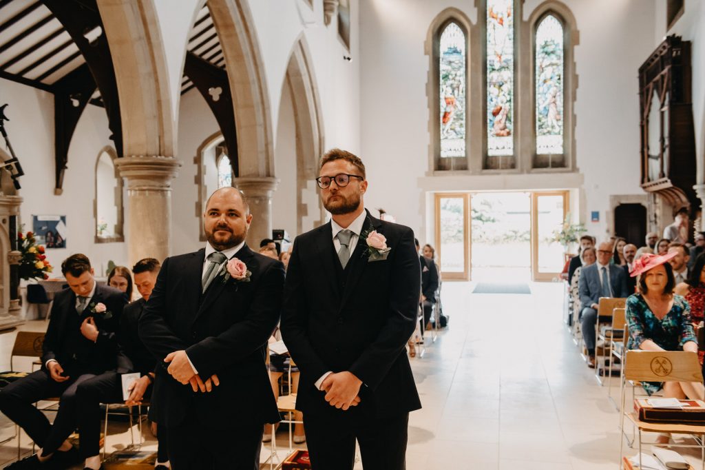 Groom and Best Man Wait at Church Alter - Surrey Wedding Photography