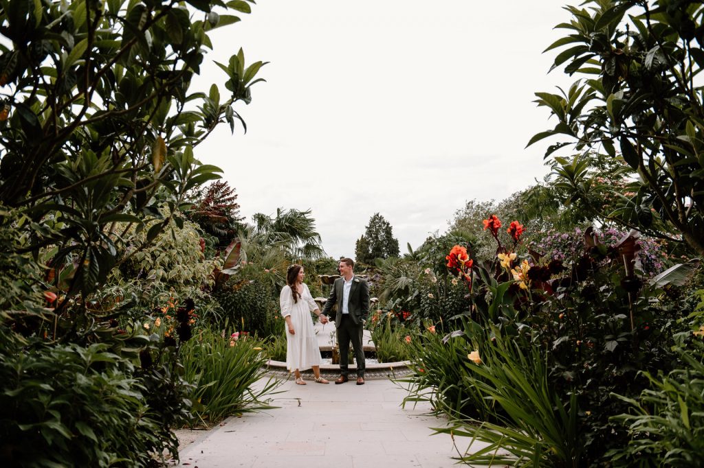 Couple Stand in the Tropical Garden at RHS Wisley Gardens for Portraits