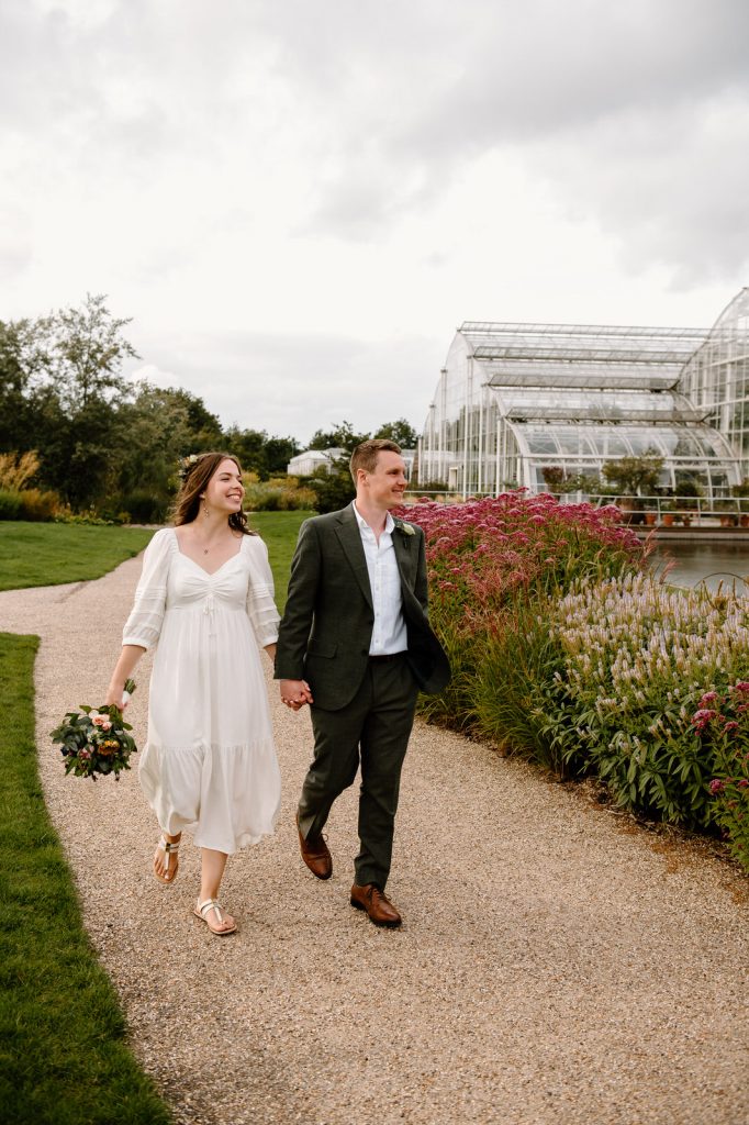 Couple Walk Together by The Glasshouse for Wedding Portraits 
