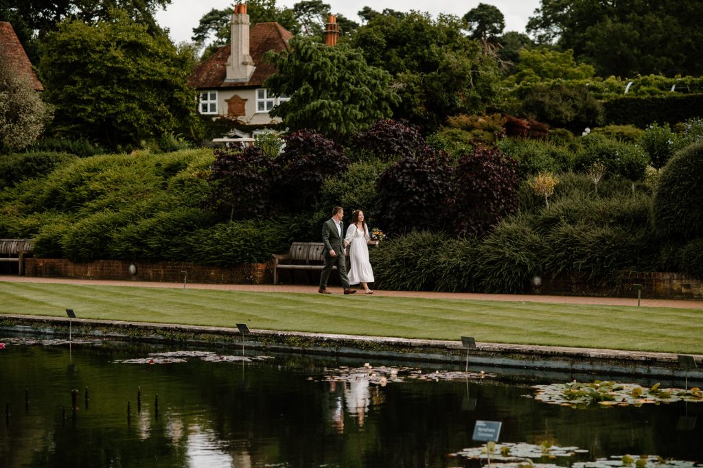 Couple Walk Together to Outdoor Wedding Ceremony 