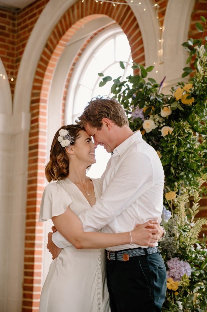 Couple Share First Kiss During Ceremony - Great Fosters Wedding