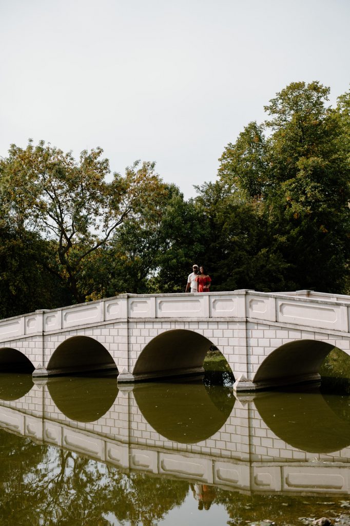 Couple Stand on The Bridge in Painshill Park