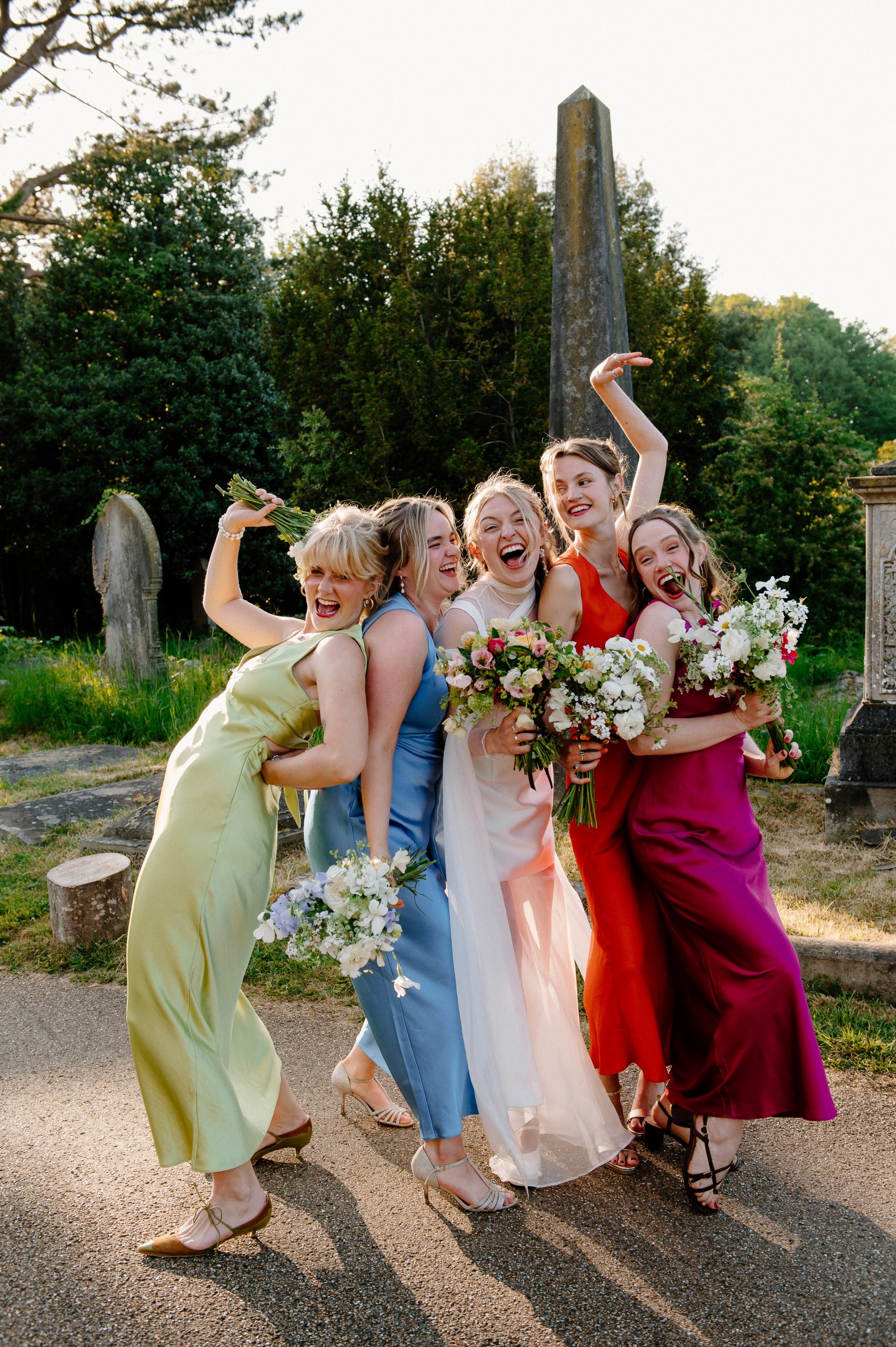 Surrey Wedding Photography Pricing - Bride and Her Gang Pose Together in The Sunshine