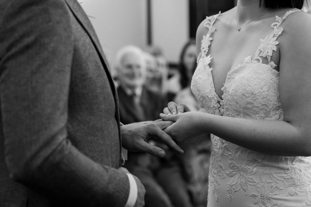 Couple Exchange Rings During Leatherhead Registry Wedding